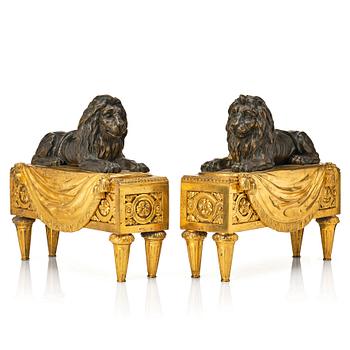 120. A pair of Louis XVI gilt and patinated bronze chenets.