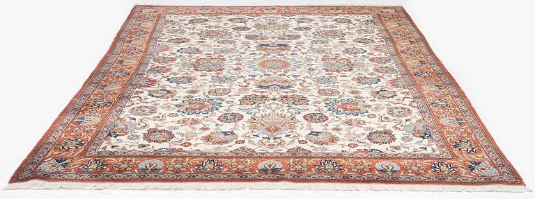 A fine semi-antique Qum carpet, c. 352 x 222 cm.
