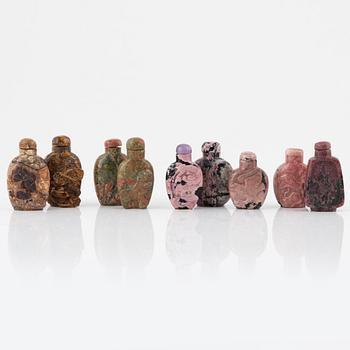 Nine Chinese snuff bottles in mottled stone, 20th century.