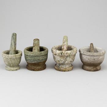 Four Swedish green marble mortars and pestles, early 20th century.