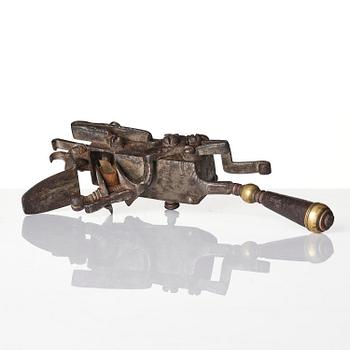 A mechanical flintlock igniter, later part 18th century/early19th century.