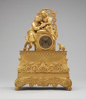 27. A French neo-Gothic circa 1830 gilt bronze mantel clock.