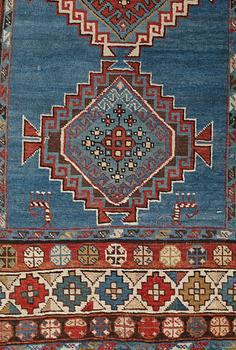 A RUNNER, a semi-antique Caucasian, ca 303,5 x 129,5-140,5 cm (as well as one end with 2,5 cm flat weave).