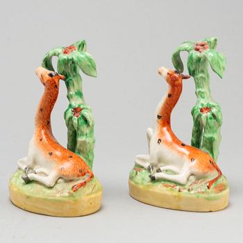 A pair of ceramic figures of giraffes, England, presumably Staffordshire, 19th century.