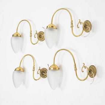 Four brass wall lights, second half of the 20th Century.