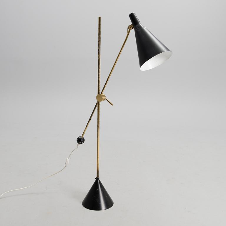 TAPIO WIRKKALA, AN ADJUSTABLE FLOOR LAMP, K10-11. Manufactured by Idman Oy. Designed in 1958.