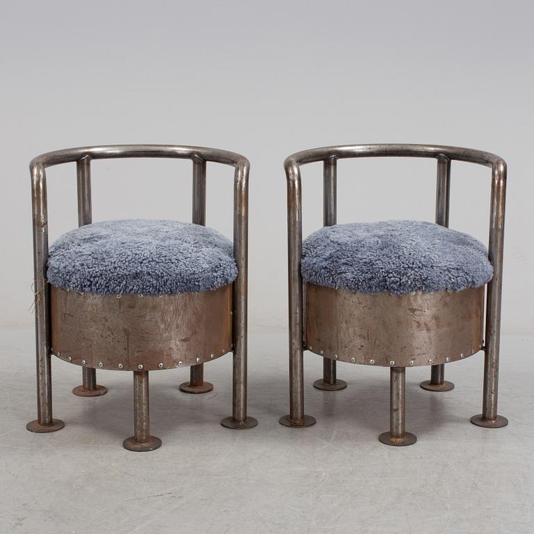 A pair of steel chairs by Arpad Földessy, 21st Century.