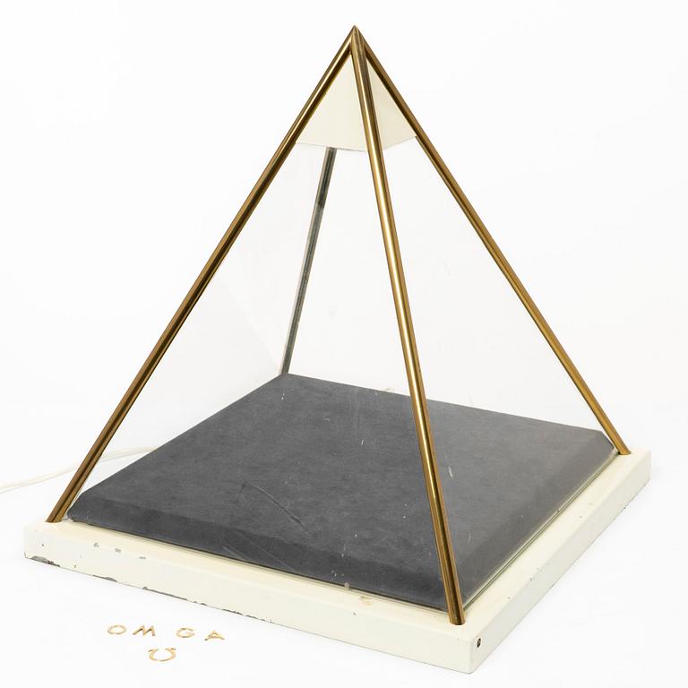 Omega, a display case.