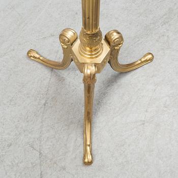 a brass coat hanger from the late 20th century.