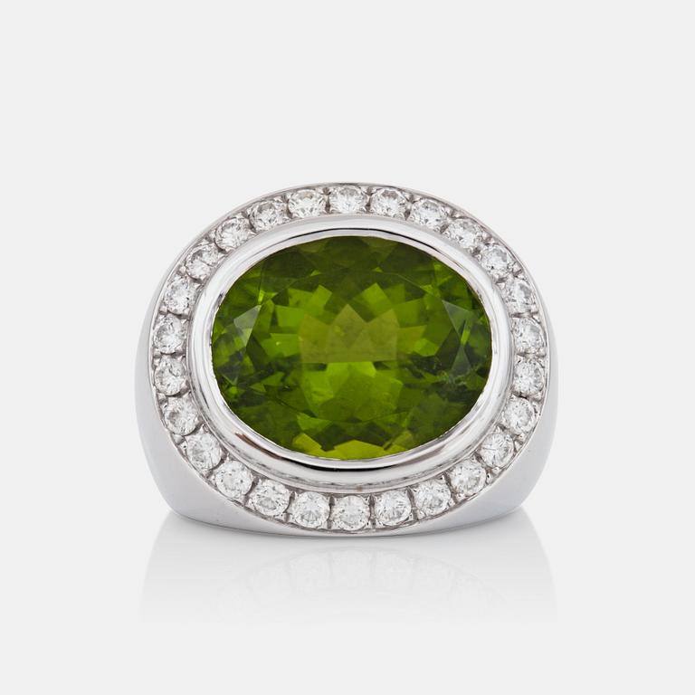 A 18.61 ct peridot and brilliant-cut diamond ring. Total carat weight of diamonds 1.34 cts. Quality H/VS.