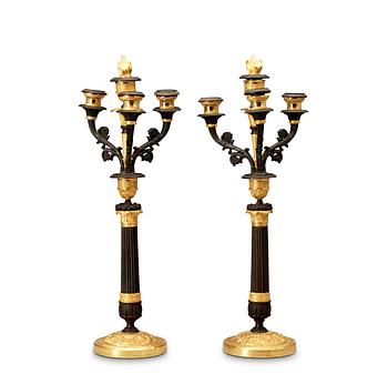 A pair of French Empire 19th century four-light candelabra.