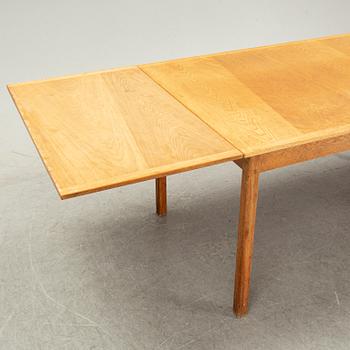Knud Andersen, a set of six chairs for J.C.A Andersen, Aarhus, Denmark and a dinner table from Troeds, Bjärnum.