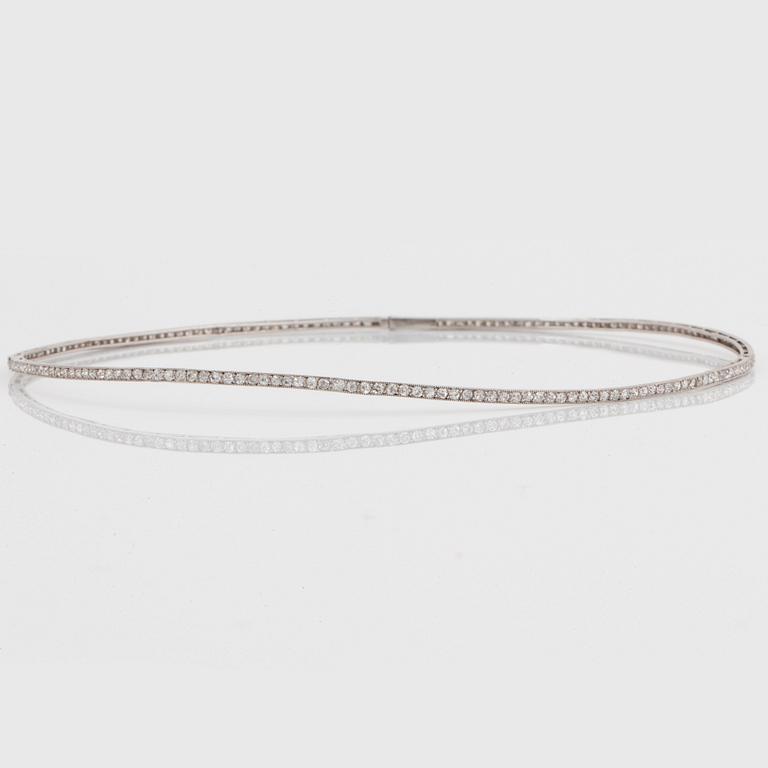 A platinum and 18K gold necklace and pendant.