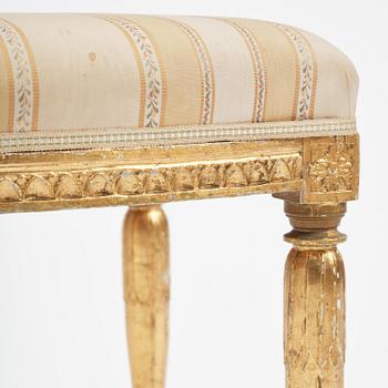 A near pair of late Gustavian giltwood stools, one by J. Hammarström (master in Stockholm 1794-1812).