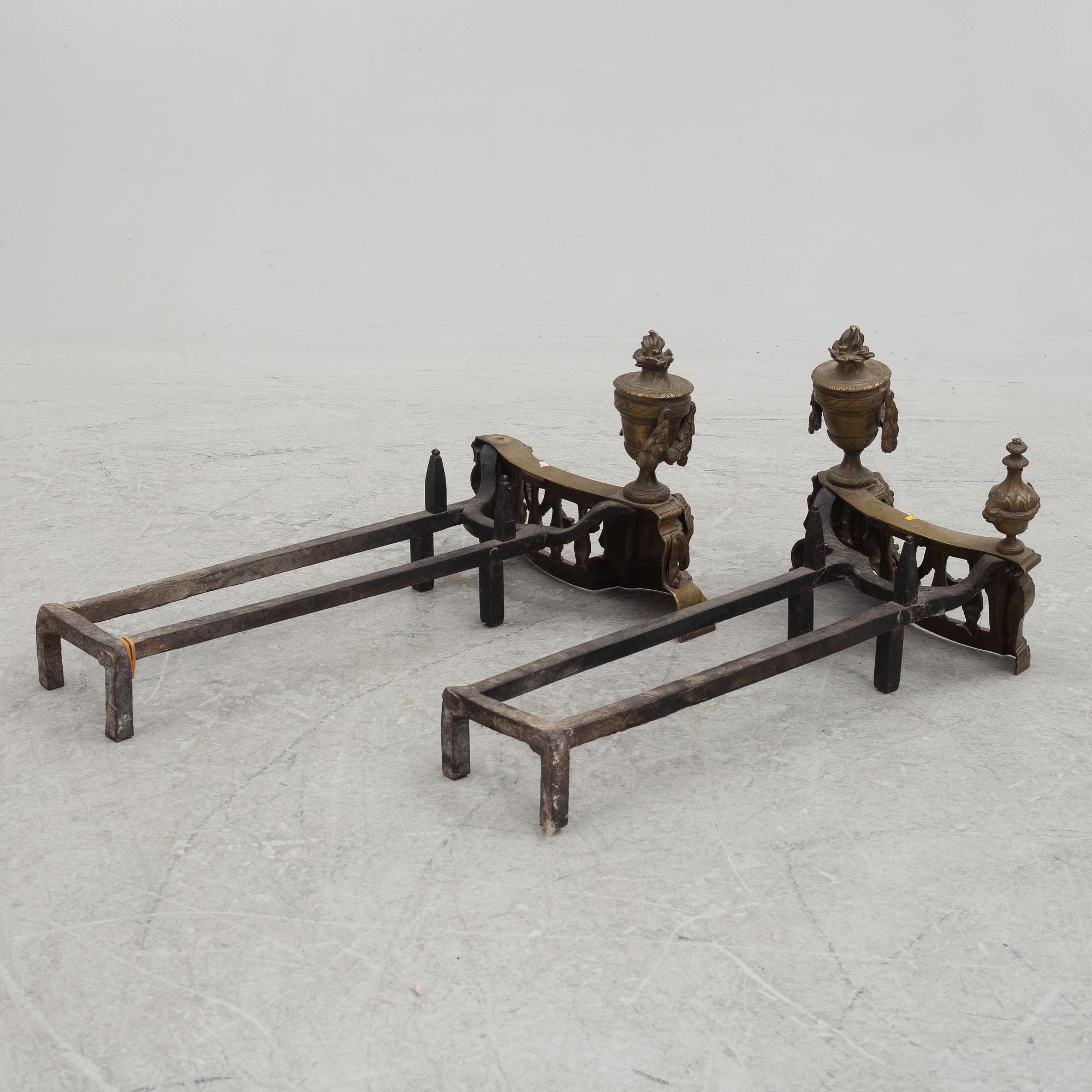 A pair of brass and forged iron andirons, late 19th century.