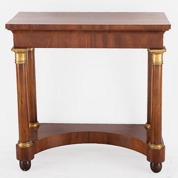 An Empire mirror and console table, first half of the 19th century.
