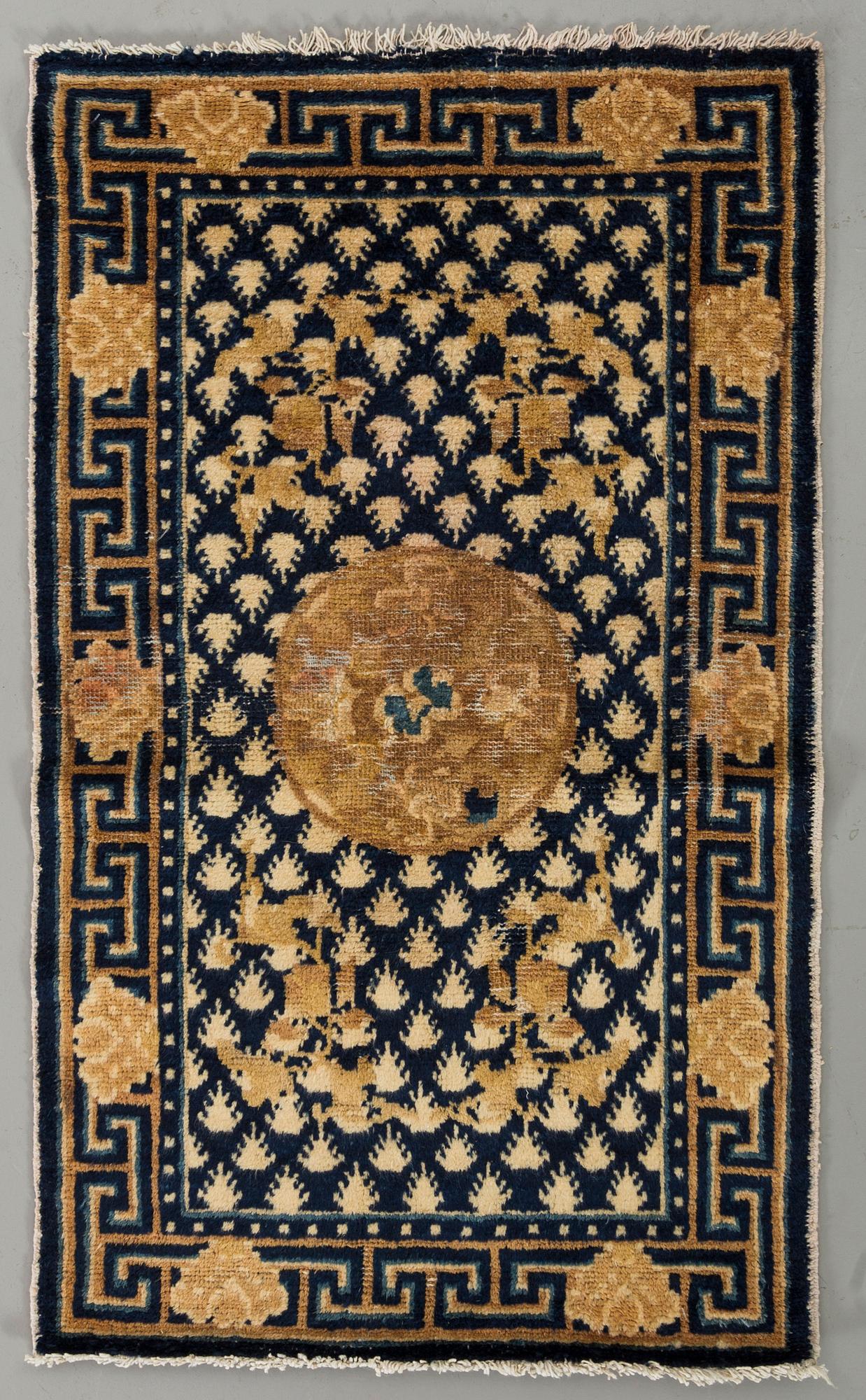A semiantique Chinese Ningxia carpet ca 94 x 58 cm.