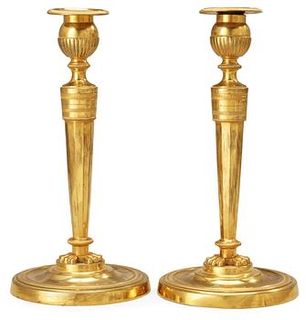 A pair of French Empire early 19th Century candlesticks.