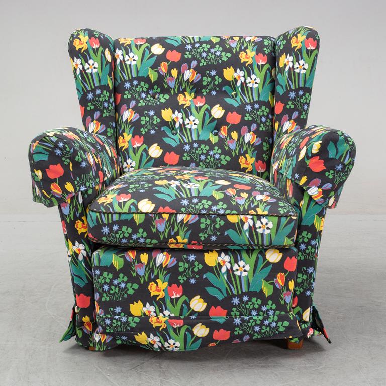 A sofa and wingback chair, later part of the 20th Century.