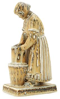 358. A Gunnar Nylund stoneware sculpture of a dairymaid, Rörstrand.