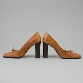 A pair of pumps by Gucci.