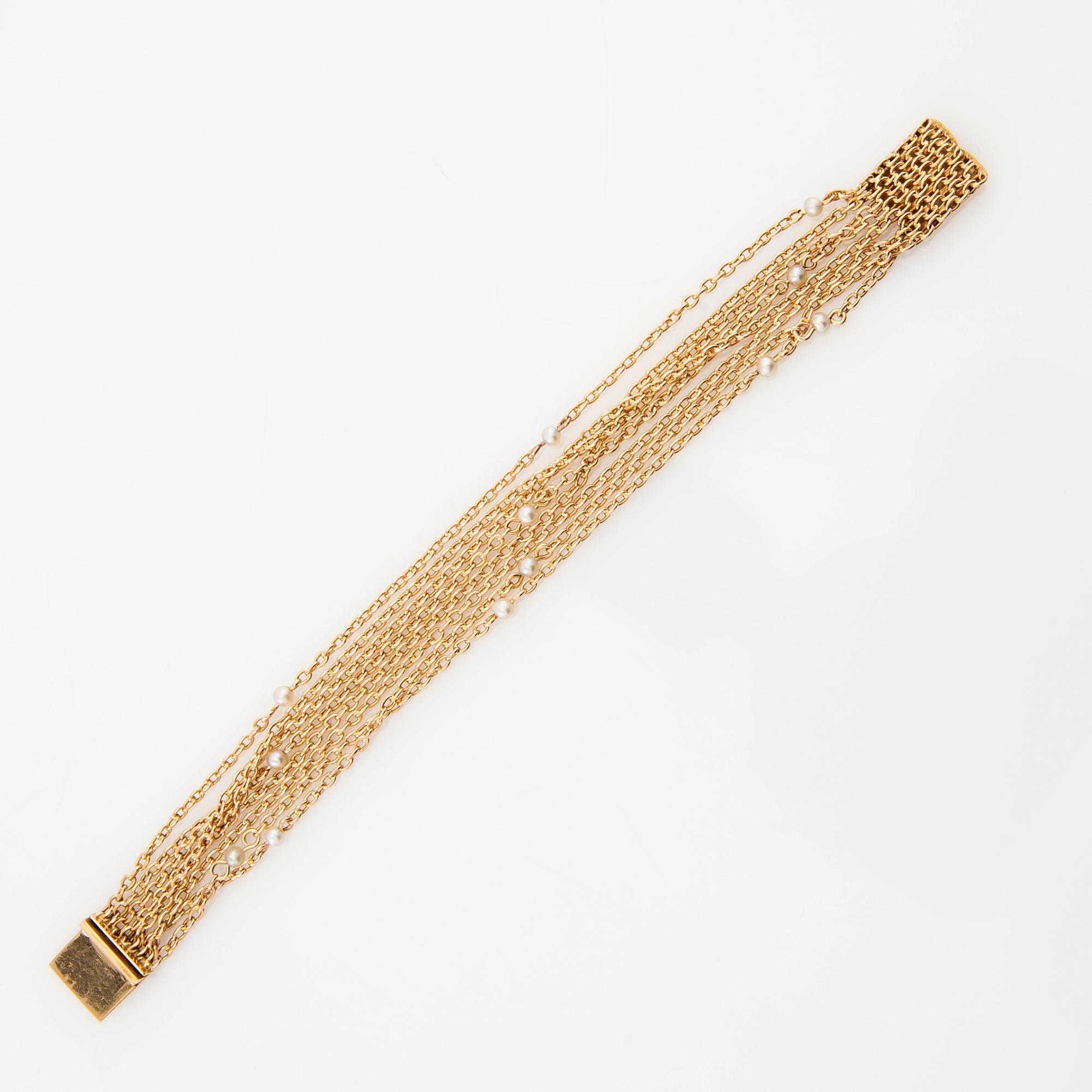 Bracelet 18K gold and seed pearls.