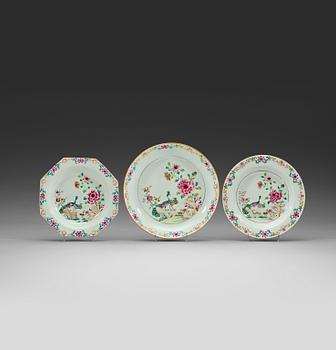 A set of six (4+2) famille rose 'double peacock' dishes and a serving dish, Qing dynasty, Qianlong (1736-95).