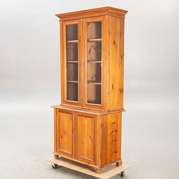 A pine display cabinet around 1900.