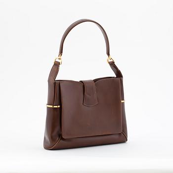 GUCCI, a brwon leather shoulder bag from the 1970s.