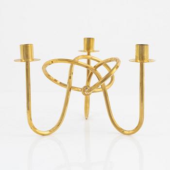 Josef Frank, a brass candelabrum, 'Vänskapsknuten', Svenskt Tenn.