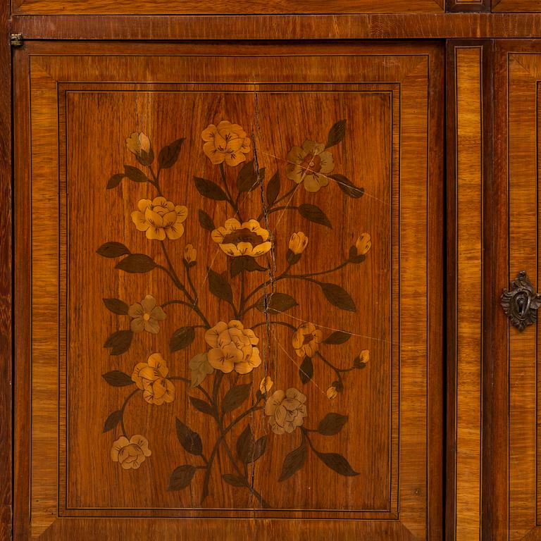A French Louis XVI-style cupboard, ca 1900.