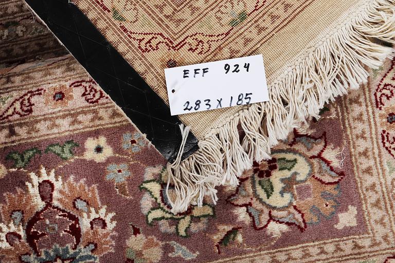 A carpet, Oriental, part silk, c. 283 x 185 cm.