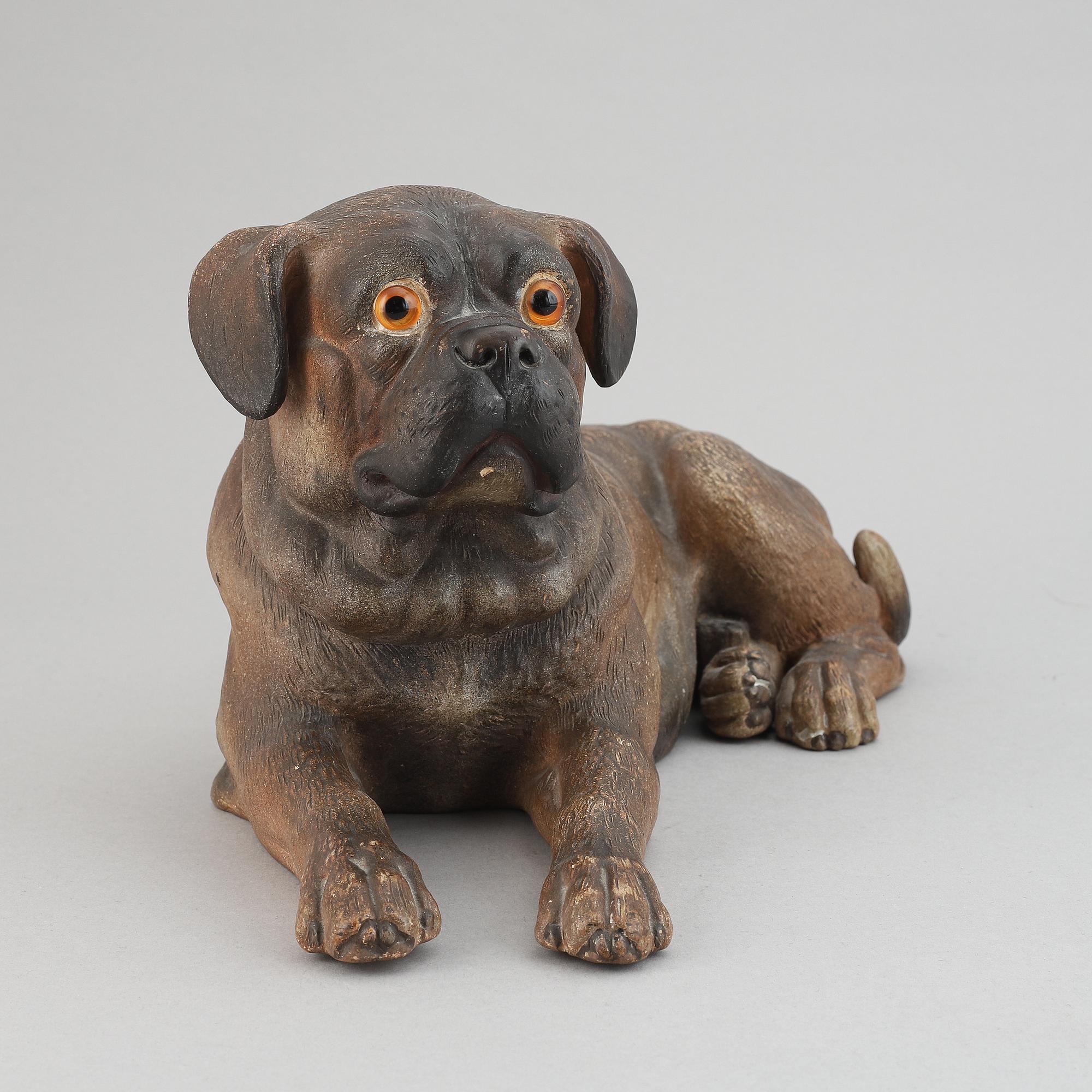 A ceramic sculpture in the shape of a dog, 20th century.