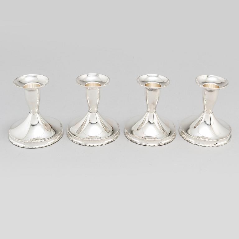 a set of four silver candlesticks by Tesi, Gothenburg 1967-1974.