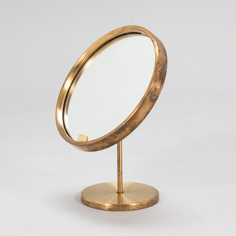 A brass table mirror, Glas Mäster, Markaryd, Sweden.