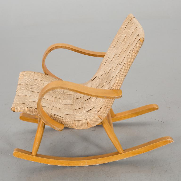 A 1940s possibly Yngve Ekstrom rocking chair.