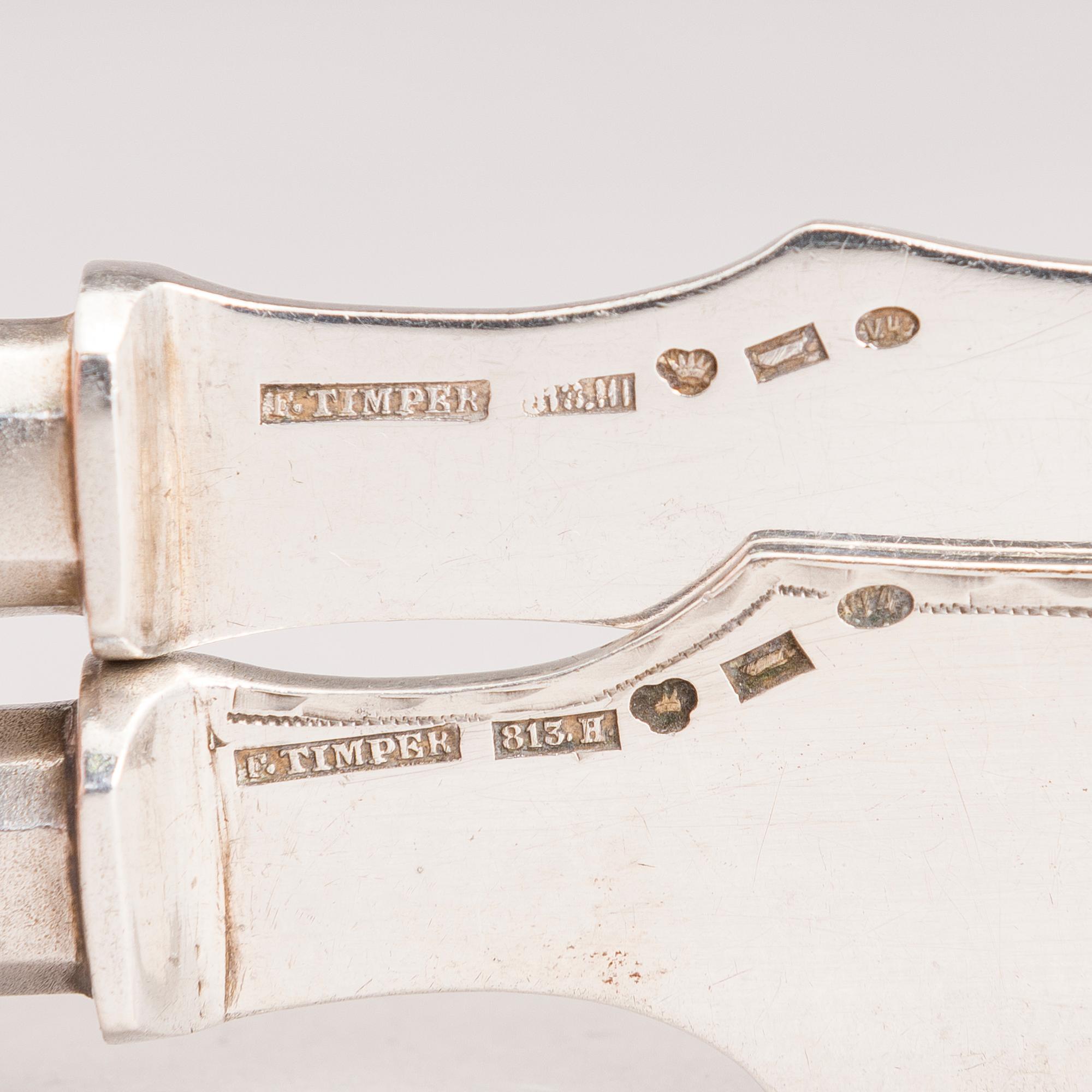 Silver serving cutlery, three with mark of Ferdinand Timper, Helsinki 1901-02 and a pair with German marks, ca. 1900.