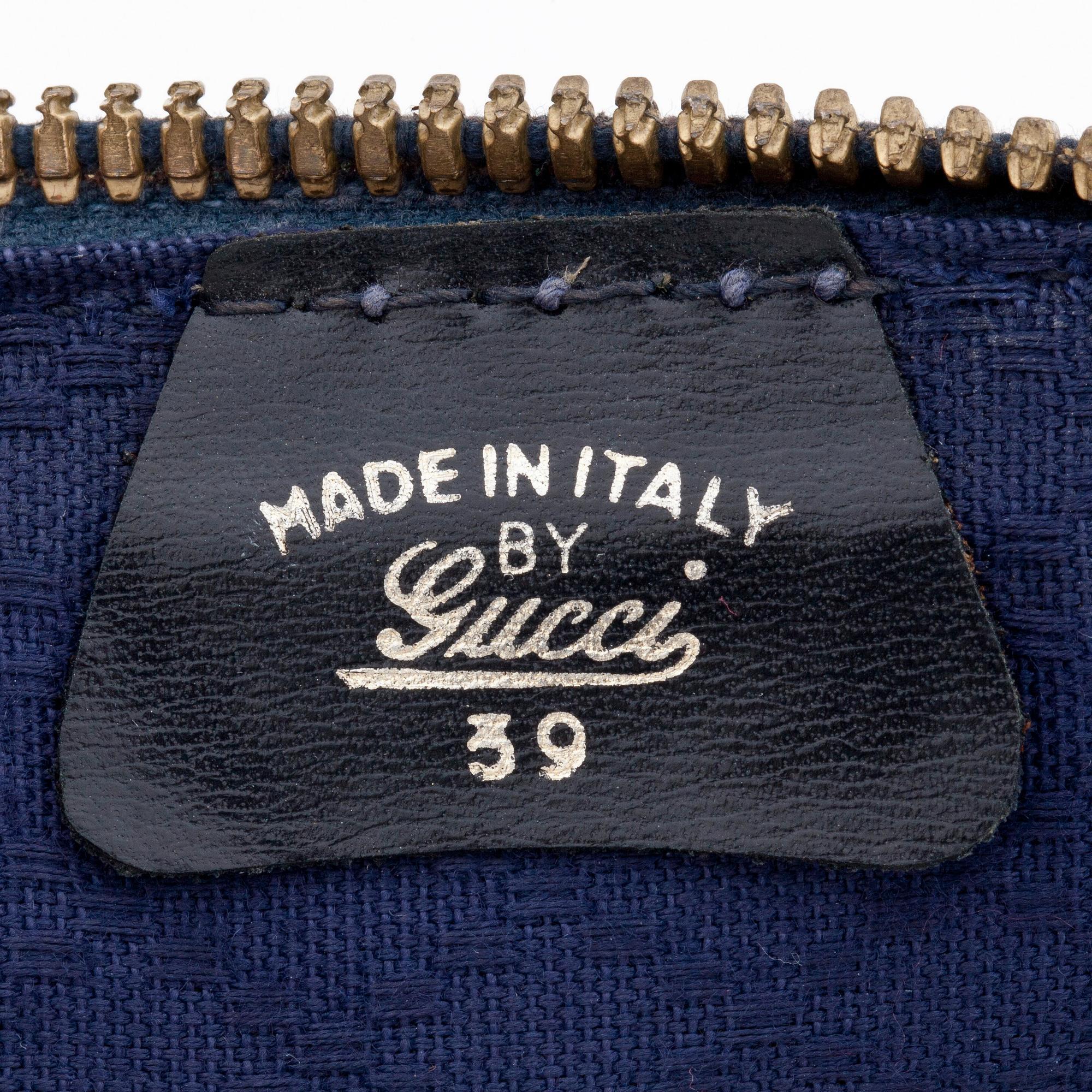 GUCCI, a blue suede and leather weekendbag.