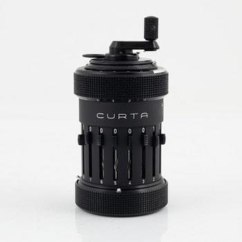 A Curta Type I mechanical calculator.