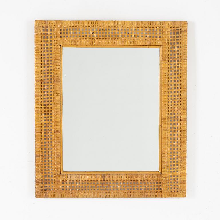 Rattan-covered frame.