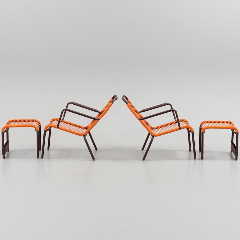a pair of FRÉDÉRIC SOFIA "Saint Tropez" lounge chairs with footstools, by Fermob.