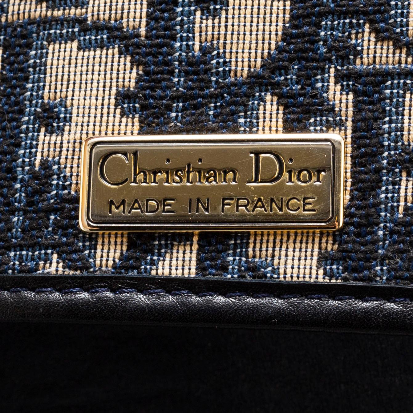 CHRISTIAN DIOR, a set of a clutch, a belt and an umbrella.