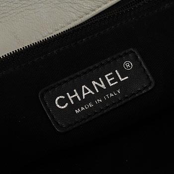 A white Chanel bag, 2010-2011.