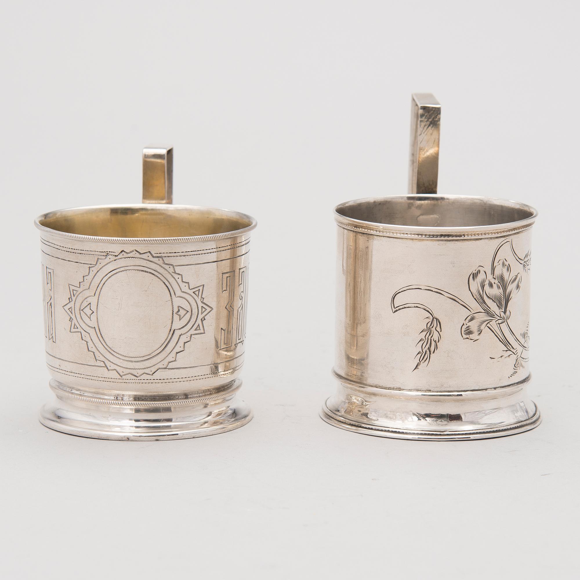 Two tea glass holders in silver, one with mark of Ivan Saltykov, Moscow 1889, the other one marked Moscow 1908-1917.