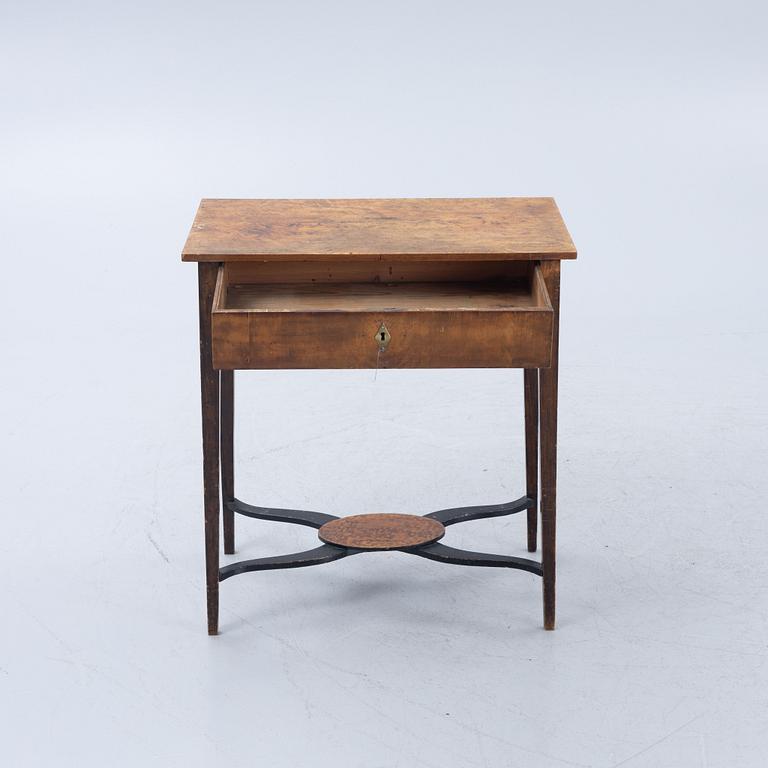 A late Gustavian burr-alder table, circa 1800.