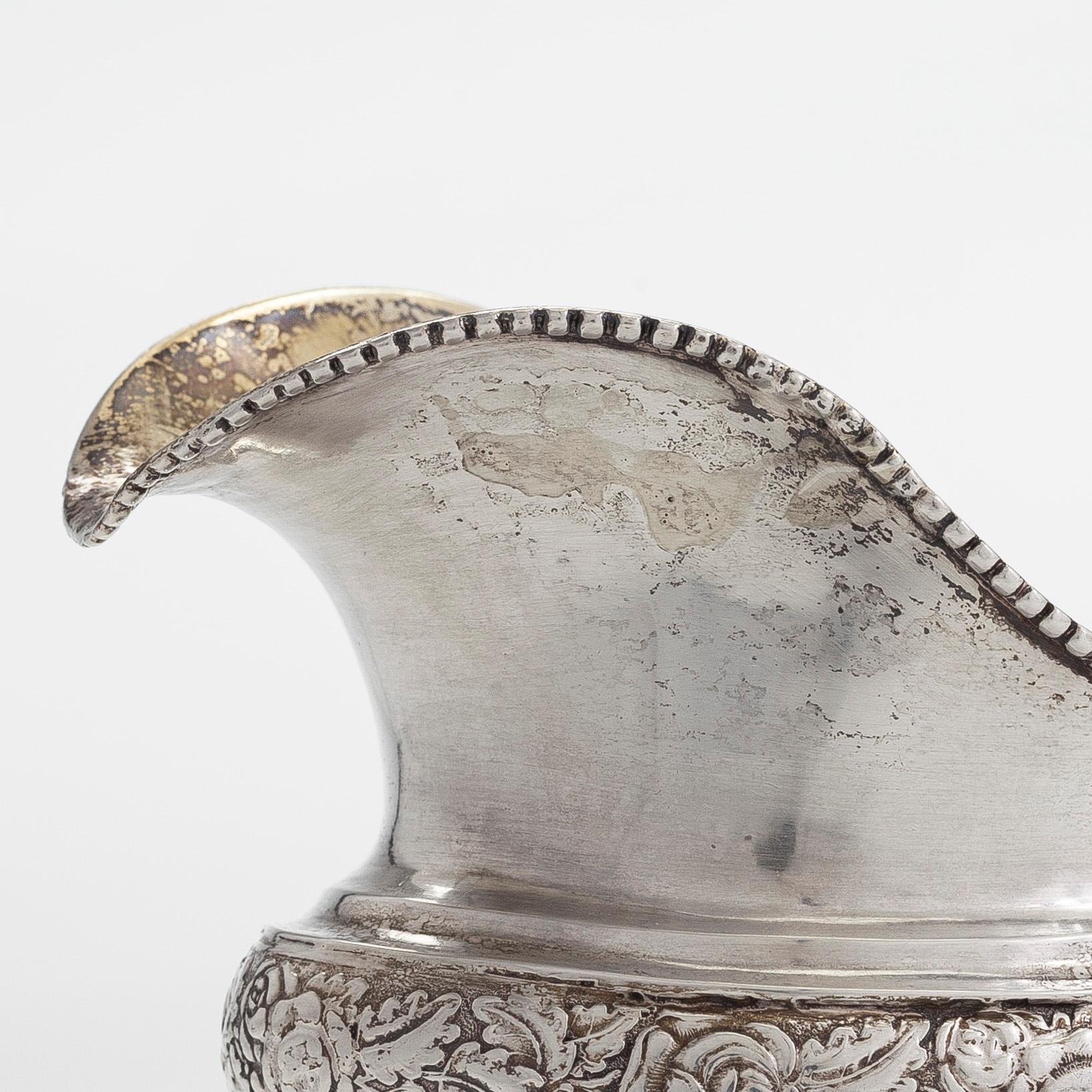 A silver coffee pot, and silver cream jug, Olof Robert Lundgren, Turku 1847 and Fredrik Strömsten, Helsinki 1839.