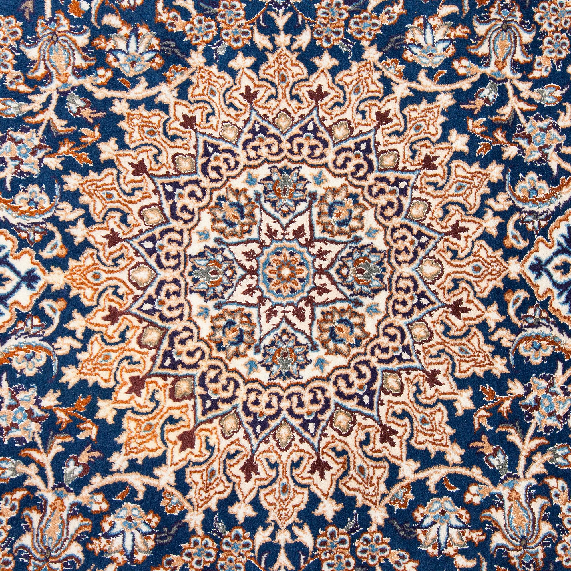 A carpet, Nain, part silk, ca. 295 x 201 cm.
