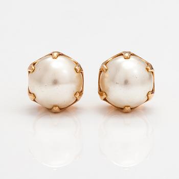 A pir of 14K gold earrings with cultured pearls.