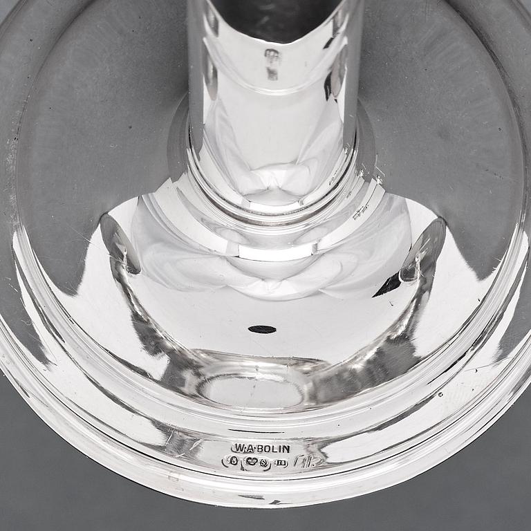 W.A Bolin, a pair of two branched silver candelabra, Stockholm 1935.