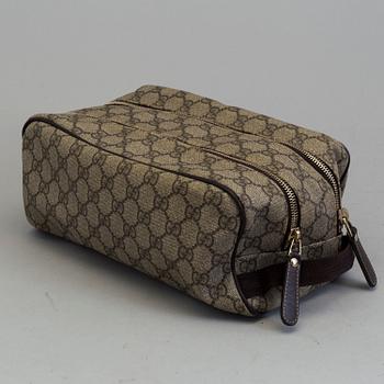GUCCI, a monogram beauty bag.